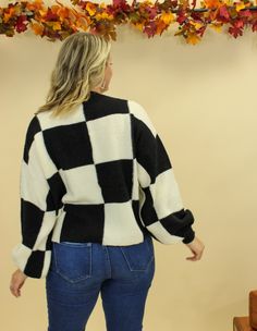 Introducing the Goldie Sweater - the ultimate winter style statement. This ultra warm and chic oversized checkered sweater is perfect for styling with jeans and boots for a cozy-cool look that will keep you warm on even the coldest winter days. The Goldie Sweater Features: Two available color combos: black/white, brown/white Oversized fit Slightly balloon sleeves Super warm fabric Fit note: This sweater is meant to fit a little oversized, but make sure to check the measurements for your preferre Plaid Long Sleeve Sweater For Fall, Oversized Plaid Sweater For Winter, Cozy Plaid Sweater, Trendy Plaid Sweater For Fall, Trendy Plaid Sweater For Winter, Oversized Plaid Sweater For Fall, Checkered Sweater, Warm Fabric, Winter Days