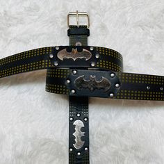 a batman belt with metal studs on it