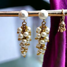 1960's Faux pearl and gold drop earrings. Clip on. Marked 'Made in Western Germany' Material: Plastic & metal Colour: Pearl & gold Size: Length - 9.5cm (3.74 inches). Width - 3cm (1.18 inches) at widest point  Weight - 6g each Condition: Excellent vintage condition. All beads intact. Clips in good condition Very minimal wear.  Please note.. I do my best to represent each item and its condition as accurately as possible but vintage items are in pre loved condition and will show signs of general a Earrings Clip, Vintage Chandelier, Gold Drop Earrings, Pearl Drop, Chandelier Earrings, Vintage Earrings, Clip On, Faux Pearl, Favorite Jewelry