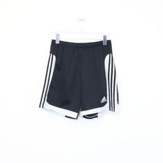 SKU - BD3440 Vintage Adidas shorts in black and white. Best fits M DETAILS: ▫️ Front logo ▫️ Drawstrings   👕 Fits like a ~ M ▫️ Label states ~  ▫️ Waist ~ 28" ▫️ Inside length ~ 7.5"  ▫️ Outside length ~ 17" Waist measurement is taken without stretching.   👇 If any defect is found and it is not included in the provided photos, it will be listed below. ▫️     🧺 All items are professionally washed and ironed before photos are taken and then sold.    ✅ If the item is listed, it is available    ❌ Adidas Logo Shorts For Streetwear, Adidas Logo Streetwear Shorts, Adidas Logo Shorts For Summer, Adidas Logo Short Bottoms For Summer, Adidas Summer Shorts With Logo, Adidas Logo Summer Shorts, Black Adidas Logo Shorts For Summer, Black Adidas Logo Summer Shorts, Black Adidas Logo Shorts