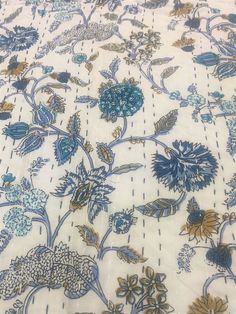 a white and blue floral print fabric