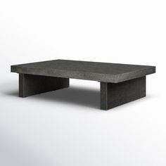 a concrete coffee table on a white background with no one around it or someone else