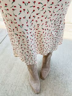 Put some flower power into your wardrobe with our Tammy Floral Midi Skirt! This ivory skirt features a red micro floral print and a comfortable elastic waistband. Perfect to pair with both graphic tees and sweaters, this midi skirt will add a playful touch to any outfit. Product Details: Measurements: WAIST small 13" medium 14" large 14.5" LENGTH small 34" medium 35" large 36" 100% polyester midi length elastic waist fully lined super comfortable model wearing size small model stats: size 4, 5'5 Casual Midi Length Floral Print Bottoms, Spring Floral Print Midi Bottoms, Spring Midi-length Bottoms With Floral Print, Spring Floral Print Midi-length Bottoms, Modest Spring Midi Skirt, Casual Ditsy Floral Print Skirt, Casual Flowy Skirt With Ditsy Floral Print, Casual Skirt With Ditsy Floral Print, Fall Floral Print Skirt For Day Out