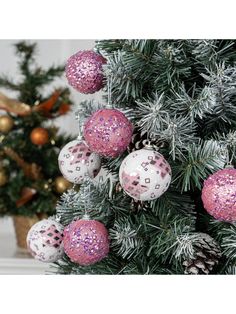 a christmas tree with pink and white ornaments