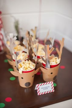 some reindeer cupcakes are sitting on a table