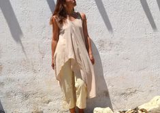 light beige organic cotton sleeveless bias cut asymmetrical long tunic top  fabric: 100% organic cotton condition: excellent,new with tags size: tag 2, fits sizes from xs to xl, shown on a small armpit to armpit: 22"-24" (bias cut) length: from 23" to 45" https://www.instagram.com/annaohsailors https://www.facebook.com/annaohsailors Summer Lagenlook Tunic With Asymmetrical Hem, Spring Beige Cotton Tunic, Beige Cotton Tunic For Spring, Summer Cotton Tunic With Asymmetrical Hem, Summer Beige Linen Tunic, Chic Beige Summer Tunic, Long Tunic Tops, Patches Fashion, Long Tunic