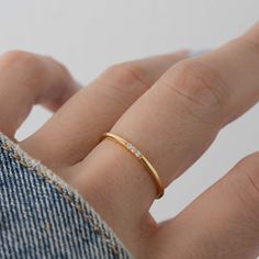 Sweet, simple, and dainty ring. Perfect for a minimalist look, or for stacking. - - - D E T A I L S - - - * Made of 925 Sterling Silver * Available in 14k Gold Plating, Rose Gold or Rhodium Plated * We use a THICK, DURABLE plating - for a piece that will last you years to come! * VERY HIGH QUALITY * Available in sizes 4-10 * Ring Width: 1.4mm * Features 3 small Cubic Zirconia Stones - made of the highest grade for an authentic diamond look! Also available in Emerald, Sapphire & Ruby! Emerald htt Gold Minimalist Ring, Simple Diamond Ring, Dainty Gold Rings, Zierlicher Ring, 3 Stone Rings, Simple Diamonds, Ringe Gold, Ruby Emerald, Demi Fine Jewelry