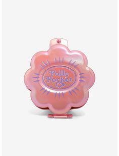 a pink flower shaped object with the words dolly pocket on it