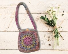 Say hello to autumn with our stylishly chic crochet bag, oozing boho-hippie vibes. This trendy little number is surprisingly spacious, perfect for your phone, wallet, and all those other can't-leave-home-without accessories. With its charming blend of earthy autumn shades and vintage sunburst granny squares, this bag adds a dash of whimsy to your outfit. Fancy a unique gift for someone special? This crochet gem is a winner! Not just pretty, it's practical too! Machine washable and ideal for dail Bohemian Crochet Mobile Phone Bag For Summer, Bohemian Crochet Bag For Daily Spring Use, Trendy Handmade Shoulder Bag For Festivals, Pink Bohemian Crochet Bag With Adjustable Strap, Bohemian Crochet Bag For Mobile Phone, Trendy Rectangular Shoulder Bag For Festivals, Trendy Festival Crossbody Bags, Handmade Hippie Rectangular Shoulder Bag, Bohemian Shoulder Bag As Spring Gift