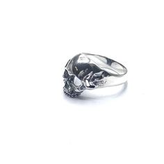 Chunky silver skull ring. Statement ring for him in solid silver . Available in size 7,8 and 9 Comes in a gift box Sterling Silver Skull Jewelry For Streetwear, Skull Shaped Sterling Silver Ring In White Gold, Classic Skull Ring Gift, Gothic Sterling Silver Rings With Skull Print, Sterling Silver Skull Ring For Promise, Silver Skull Ring For Streetwear, Silver Open Skull Ring, Silver Gothic Skull Ring, White Gold Skull Rings For Gifts