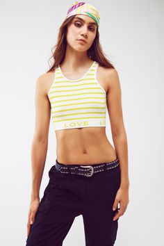 Make a bold statement with our Striped Cropped Top with Love Text in Lime Green. This trendy and vibrant crop top is designed to turn heads and add a playful touch to your outfit. With its cropped length, this top offers a stylish and youthful look, perfect for pairing with high-waisted bottoms. The stripe design adds a visually appealing element, while the contrast collar provides a pop of color and adds a unique detail to the overall design. Designed with a sleeveless style and bodycon fit, th Chic Slightly Cropped Cotton Crop Top, Cotton Crop Top For Day Out With Cropped Hem, Cropped Tank Top For Day Out, Cotton Cropped Top For Day Out, Summer Stretch Cropped Hem Tank Top, Stretch Cropped Hem Tank Top For Summer, Summer Cropped Hem Crop Top, Trendy Stretch Crop Top With Cropped Hem, Spring Cotton Crop Top With Cropped Hem