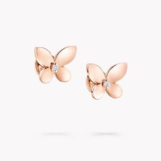 With the stylish Mini Butterfly Stud Earrings, Graff revisits one of its most treasured motifs. Freshly interpreted in 18 carat rose gold, the butterfly’s gleaming wings are delicately angled, introducing a beautiful sense of volume, with a Graff diamond set between. Finessed by our master craftsmen to reflect the light from its polished wings, these enchanting golden butterflies displays the strong, clean edges that are a signature of every Graff jewel. At Graff we experiment with settings that Elegant White Gold Earrings With Butterfly Charm, Elegant Butterfly Earrings For Formal Occasions, Formal Butterfly Diamond Earrings, Luxury Yellow Gold Butterfly Earrings, High Jewelry Design, Rare Diamonds, Graff Diamonds, Mini Butterfly, Round Diamond Earrings