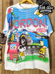 #nascar #JeffGordon #Peanuts #Snoopy #racing #tee #tshirt #streetwear #vintagereprint #alloverprinttshirt #vintaget #alloverprint #aop Vintage Multicolor Screen Print T-shirt, Vintage Short Sleeve Top With All Over Print, Vintage Crew Neck Top With Sublimation Print, Vintage Cotton T-shirt With All Over Print, Retro Blue Printed T-shirt, Cotton Sublimation Streetwear With Printed Design, Cotton Sublimation Printed Streetwear, Vintage Cotton T-shirt With Sublimation Print, Cotton Pop Culture Tops With Sublimation Print