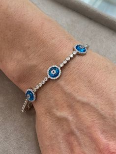 Silver Evil Eye Bracelet , Blue Stone Bracelet , Handmade Jewelry Bracelet , Good Luck Bracelet , 925K Sterling Silver Jewelry ,Gift For Him .. ★Item Details * Material : 925K Sterling Silver * Total weight : 10 Grams * Length : 18 Cm ✔ Ready to Ship in 1-2 Business Days .. ✔ Shipped to the Worldwide 1-5 business days with free shipping... ✔ The product will be sent to you with a handmade wooden box to avoid any damage during shipping... ✔ Visit our store, browse other Men's jewelry, silver and Blue Hand-set Bracelet As A Gift, Adjustable Blue Round Tennis Bracelet, Adjustable Blue Jubilee Charm Bracelet, Adjustable Blue Jubilee Chain Bracelet, Adjustable Blue Tennis Bracelet, Blue Diamond Bracelet With Hand Set Stones, Blue Hand Set Diamond Bracelet, Blue Hand Set Round Diamond Bracelet, Blue Jubilee Bracelet