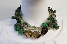 "This necklace will not disappoint. It is a one of a kind statement piece of jewelry, an investment. Made with beautiful Natural Green Turquoise, Smoky Quartz and Green Garnet also known as Prehnite and topped off with 925 Sterling Silver. This is a handmade piece and will not be duplicated. This piece is large. It adjusts from 17\" to 19\" long and is a lobster clasp with cone capped ends.  The faceted natural smoky quartz is polished and stunning. Runs in several sizes from small beads to larg Luxury Green Stone Necklaces, Artisan Green Multi-stone Jewelry, Luxury Green Necklaces With Natural Stones, Unique Multi-stone Green Jewelry, Unique Green Multi-stone Jewelry, Unique Green Natural Stone Necklace, Artisan Green Stone Necklaces, Artisan Green Stone Necklace, Artisan Green Multi-stone Necklaces