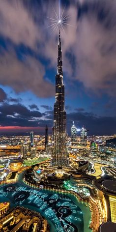 an aerial view of the burj tower at night in dubai, united kingdom