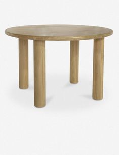 a round wooden table with four legs