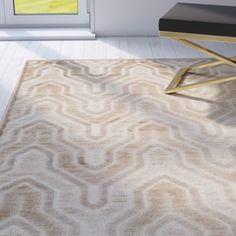 a beige rug with an abstract design on the floor in front of a white door