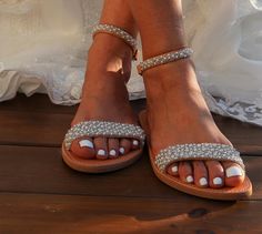 These beautiful bridal sandals are definitely one of our best models with an elegant embroidered finish with pearls and beads that are sewn by hand on leather straps Full sizes only ** If you have half the size, go UP to the nearest full size. ** If you are unsure of your size, please contact me so I can assist you. Check out our other wedding sandals here: MORE WEDDING SANDALS: https://www.etsy.com/listing/932339383/wedding-sandals-lace-wedding-shoes-beach?ref=shop_home_feat_4&pro=1&frs Summer Open Toe Pearl Wedding Shoes, Summer Wedding Pearl Open Toe Shoes, Bridal Shower Pearl Embellished Ankle Strap Sandals, White Pearl Wedding Shoes For Summer, Summer Pearl White Wedding Shoes, Pearl Open Toe Sandals For Summer, Summer Pearl Open Toe Sandals, White Beaded Sandals For Wedding, White Beaded Wedding Sandals