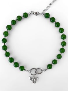 Considered as one of the most precious, treasured stones, jade represents strength and invites both luck and good health. Deep greens found in jade parallel to having more yang, allowing stronger energy - thus, making the 'DIVINE' jade beaded necklace that much more special. From the hand strung grade A jade stones, to the stainless steel rings and pendant, this piece is guaranteed to get the compliments rolling in... Made with stainless steel rings and pendants. Waterproof and rust-free. Availa Jade Jewelry With Natural Stones For Meditation, Jade Gemstone Beads Jewelry For Meditation, Green Jade Jewelry For Meditation, Green Jade Spiritual Jewelry, Spiritual Jade Jewelry For May Birthstone, Spiritual Jade Crystal Necklaces With Round Shape, Green Jade Spiritual Necklace, Spiritual Green Jade Necklace, Spiritual Green Agate Jewelry