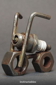 an old rusty metal toy truck with two springs on it's front end and one wheel