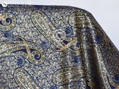 Indian Blue Brocade by the Yard Banarasi Wedding Dresses Material Sewing Lehenga Skirt Men Vests Jackets Costumes Curtain Upholstery craft. This is a beautiful multi color banarasi brocade in floral design fabric in multi color (Blue with Yellow, Green, Black) and Gold. ➤Product: Brocade Fabric ➤Fabric Type: Blended Silk (Viscose + Rayon and 30% Silk) Fine quality Zari Brocade Weaving from Banaras ➤Color: Base color is Blue with Yellow, Green, Black and Gold ➤Width: 42 inches. ➤Condition: New ➤ Blue Silk Fabric For Wedding, Blue Brocade Fabric For Wedding, Elegant Blue Fabric For Festive Season, Elegant Blue Fabric For Festive Occasion, Elegant Festive Blue Fabric, Blue Fabric With Traditional Patterns For Weddings, Blue Wedding Fabric With Traditional Patterns, Blue Fabric With Traditional Patterns For Festive Occasions, Blue Fabric For Wedding And Festivals