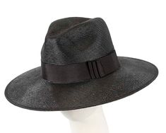 This beautiful black ladies hat features classic fedora shape with fashionable wide brim. It is made from real natural sisal.  Real sizal  Wide brim  Classic elegant shape Chic Fedora Panama Hat For Kentucky Derby, Elegant Fedora With Curved Brim For Vacation, Elegant Fedora Panama Hat For Vacation, Elegant Brimmed Fedora For Vacation, Elegant Wide Brim Fedora For Vacation, Black Brimmed Panama Hat For Formal Occasions, Black Wide Brim Panama Hat For Formal Occasions, Elegant Fedora Straw Hat For Vacation, Formal Black Brimmed Panama Hat