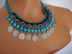 the necklace is adorned with coins and beads