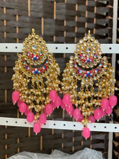 Hand painted meena earring . Push back. Approximately 5 inch long Handmade Kundan Dangle Danglers, Handmade Kundan Dangle Earrings, Unique Pink Festive Jewelry, Traditional Pink Meenakari Chandelier Earrings, Traditional Hand Painted Drop Earrings, Hand Painted Dangle Earrings For Party, Hand Painted Pink Jewelry For Party, Handmade Multicolor Kundan Danglers, Multicolor Kundan Dangle Earrings