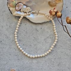 "Cultured Freshwater Pearl Strand Necklace.  Princess of 18\" or Matinee Length of 24\" long. Pearl Size: 8-9MM. Pearl Quality: Lightly wrinkled and blemished.  Great luster. Pearl Shape: semi-round. Finding: Sterling silver toggle loop clasp. https://www.etsy.com/shop/MYGEMSROCK" Single Strand Round Necklace For Anniversary, Single Strand Pearl Necklace Gift, Single Strand Round Pearl Necklace Gift, Single Strand Round Pearl Necklace As Gift, Classic Single Strand Necklace Gift, 16 Inch White Pearl Necklace For Gifts, Classic Necklace With Lobster Clasp For Anniversary, Gift Pearl White Necklace, Classic Adjustable Necklaces With Sterling Silver Clasp