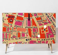 an image of a map on the side of a cabinet that is painted pink and orange