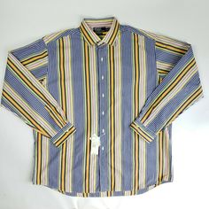 Polo Ralph Lauren Westerton men's button front shirt Size XXLarge Blue, yellow, green, black, orange, red stripe 7 button placket Long sleeves Button cuffs 100% cotton Machine wash, tumble dry New with tags. Original retail price $89.50   Measurements taken with garment laying flat: Chest:  28.5 inches Shoulder to shoulder:  21.25 inches Middle of collar to cuff:  39 inches Top back collar to hem:  36 inches Any questions, please ask.  Shipping Information: I will happily combine shipping if you Casual Striped Button-up Dress Shirt, Multicolor Button-up Shirt With Button Cuffs, Striped Collared Dress Shirt With Button Closure, Classic Multicolor Button-up Shirt, Striped Button-up Cotton Dress Shirt, Red Stripe, Button Front Shirt, Flat Chest, Black Orange