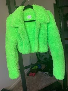 Hey girlie, I made this neon green coat for you to fulfil all your y2k, harajuku, punk, and grunge vibes. This versatile jacket can be styled to create the most fire outfits since it's unique, stylish, and bold.  Believe it or not, this is indeed crocheted (and by yours truly, no less). The colour is captured most accurately in the first two photos. It is a rich neon green. MEASURMENTS This jacket fits a US size small. * Length: 15.5 inches * Width: 20 inches * Sleeve: 28 inches DETAILS * Super warm * Cropped fit * Long arms great for tucking your hands into to keep them warm, or they can also be folded shorter without much extra bulk    since the fur blends into itself * The bottom of each side of the collar is sewn down to the bottom hem of the jacket in order to help keep the shape * Cr Y2k Long Sleeve Winter Outerwear, Fall Rave Outerwear With Long Sleeves, Fall Rave Long Sleeve Outerwear, Rave Long Sleeve Outerwear For Fall, Trendy Green Outerwear, Trendy Green Long Sleeve Outerwear, Y2k Fitted Long Sleeve Outerwear, Green Trendy Outerwear For Streetwear, Trendy Green Streetwear Outerwear