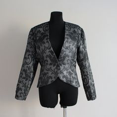 "Jacquard Blazer Brocade Blazer Tapestry Blazer Silver Jacket Floral Print Blazer Shiny Glam Suit  Hand made Shown on model S size Measurements (lying flat): Length: 22.5\"/ 57.5 cm Bust: 20\"/ 51 cm Sleeve: 23.5\"/ 60 cm Shoulders: 17\"/ 43.5 cm Waist: 15 3/4''/ 40 cm Please check measurements to insure a proper fit. Remember to allow yourself some extra room for movement. You can compare these with something from your closet that fits you well. Please convo me if you need additional measuremen Jacquard Long Sleeve Blazer For Parties, Jacquard Long Sleeve Party Blazer, Jacquard Party Blazer, Fall Jacquard Outerwear For Party, Fitted Jacquard Blazer With Long Sleeves, Elegant Jacquard Blazer For Party, Brocade Long Sleeve Party Blazer, Brocade Long Sleeve Blazer For Party, Brocade Blazer With Long Sleeves For Parties