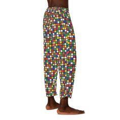 "Enjoy our super-popular Rubik's Cube pattern on these pajama pants!    Made of 100% polyester jersey knit fabric - a silky smooth choice that, along with the relaxed fit, helps anyone feel at ease. \\n\\n.: 100% polyester\\n.: Light fabric (6 oz/yd² (203 g/mn.: Relaxed comfort fit\\n.: Back elastic and a black drawstring tie\\n.: White seam thread\\n.: Sewn-in care label ABOUT THE COOL CUBE MERCH SHOP - https://www.etsy.com/shop/CoolCubeMerch If you are looking for a fun Rubik's Cube shirt, Rubik's Cube clothing, Rubik's Cube Gifts, or any other Rubik's Cube Merchandise, then Cool Cube Merch is the right place for you! We have over 50 designs and over 250 items, so you're not limited to just a melting Rubik's cube shirt or ordinary options. At Cool Cube Merch, we strive to have the right Casual Multicolor Printed Sleepwear, Playful Sweatpants With Elastic Waistband For Loungewear, Playful Elastic Waistband Pants, Playful Relaxed Fit Bottoms With Elastic Waistband, Multicolor Cotton Sleepwear Pants, Multicolor Cotton Sleepwear Long Pants, Casual Sweatpants With Elastic Waistband For Pajama Party, Playful Relaxed Fit Sweatpants For Loungewear, Casual Multicolor Pants With All Over Print