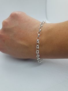 This beautiful delicated bracelet has been carefully crafted in solid 925 sterling silver. Great for any ocassion! Buy it for your-self or for someone you love . Bracelet can also be resized at no extra cost and it will be shipped to you in an elegant gift box. A tracking shipping number will be provided to you once the bracelet has been mailed. Bracelet length: 8 inches Weight: 5.1 grams Materials: 925 Solid Sterling Silver, also available in 10k Yellow Gold Lobster claw Thanks for visiting my Silver Charm Bracelet With Rolo Chain For Gift, Everyday Charm Bracelet With Rolo Chain, White Gold Sterling Silver Bracelet With Rolo Chain, Sterling Silver Charm Bracelet With Rolo Chain For Gift, Sterling Silver Charm Bracelet With Rolo Chain, Sterling Silver Rolo Chain Charm Bracelet Gift, Classic Sterling Silver Charm Bracelet With Silver Chain, Sterling Silver Bracelets With Lobster Clasp In White Gold, Dainty Silver Link Charm Bracelet