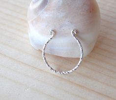 This listing is for ONE unique fake septum ring cuff 925 sterling silver .~NO PIERCING REQUIRED~It is extremely comfortable to wear and look just like a real piercing, without the pain!adjustable to fit your nose comfortably.HOW TO WEAR IT: Open the cuff slightly if necessary. Slide the cuff up around your nasal septum and squeeze gently to secure in place. THAT'S IT!size:22 gauge.Inner Diameter :8mmOther fake septum cuffs:https://www.etsy.com/listing/212526033/tribal-gold-fake-septum-ring-faux- Nickel-free Sterling Silver Septum Ring, Silver Open Ring Septum As Gift, Silver Open Ring Septum Gift, Hypoallergenic White Gold Septum Ring In Sterling Silver, Handmade Sterling Silver Septum Ring, Hypoallergenic Sterling Silver Septum Ring, Nickel-free White Gold Sterling Silver Nose Rings, White Gold Sterling Silver Septum Ring Gift, Adjustable Sterling Silver Hoop Septum Ring