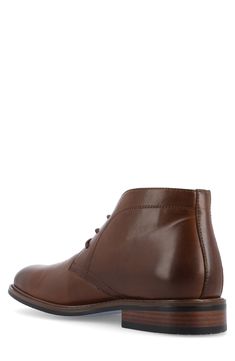 Elevate your work-to-weekend look in this refined faux-leather chukka boot featuring tonal stitch construction, breathable lining and a Tru Comfort Foam insole. Synthetic upper/textile lining/rubber sole Imported Brown Chukka Boots For Fall Workwear, Brown Ankle Chukka Boots For Work, Classic Faux Leather Boots For Work, Brown Chukka Boots With Goodyear Welt For Work, Fall Workwear Chukka Boots With Leather Lining, Leather Desert Boots For Fall Workwear, Plain Toe Leather Lined Work Boots, Casual Plain Toe Boots For Office, Casual Plain Toe Office Boots