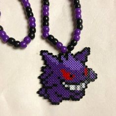 Kandi Necklace- Gengar Pokmon Handmade With Lots Of Love Made With Mini Perler Beads Super Stretchy Fabric Cord Perler Bead Kandi Necklace, Trippy Mushroom Perler Bead Patterns, Purple Beaded Necklace With Round Black Beads, Purple Beaded Necklaces For Gifts, Purple Necklaces With Colorful Beads For Gift, Purple Beaded Necklace As Gift, Purple Necklace With Colorful Beads For Gift, Purple Necklace With Black Beads, Handmade Black Beads For Crafting