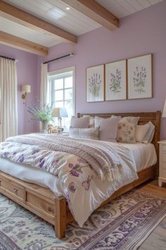 a bedroom with purple walls and white bedding in the center is decorated with lavender flowers