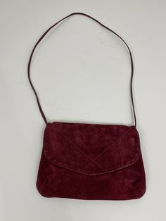 Richmark Burgundy Suede Envelope Cross Body bag Evening Bag made in America. This slim profile, envelope styled bag is from an estate. Exterior suede finish has no stains, rips, tears or smells. Interior has one small stain. Purse measures 10.5 inches wide by 7.5 inches tall and one half inch thick. Strap drop is 20 inches. Weight is 6 ounces. Condition is “pre-owned”. Ships with USPS Priority Mail. Estate Exterior, Burgundy Bag, One Half, Made In America, Cross Body Bag, In America, Body Bag, Priority Mail, Evening Bags