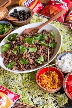 several bowls filled with food on top of a table