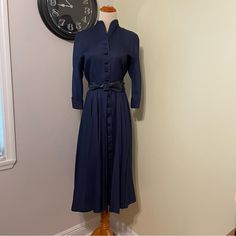 This Dress Is Vintage 50’s Toby Ny. Just Like One Audrey Hepburn Wore On A Plane. Navy Blue Shirt Dress, Do,And Sleeves P, Turn Up Cuffs And A High Curved Mandarin Collar. Comes With Original Leather Belt. Pleated Skirt Is Full If Worn With A Petticoat. High Quality Gusset In The Armpit. One Small Discoloration On A Shoulder Blade, Barely Noticeable When Worn. Otherwise Great Condition. No Pets Non Smoking Home! Navy Blue Shirt Dress, Navy Blue Dress Shirt, New Look Dresses, Navy Blue Shirt, Blue Shirt Dress, A Plane, Turn Up, Audrey Hepburn, Navy Color