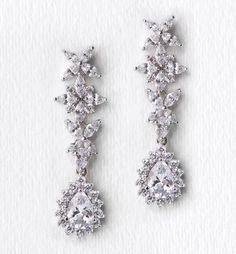 pair of diamond earrings on white background