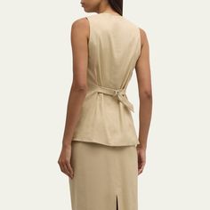 Veronica Beard "Liff" linen-blend suiting vest V neckline  Sleeveless Adjustable back belt  Hip welt pockets  Tailored fit Cut-away hem Button-front  Linen/viscose/elastane Lining: Polyester Dry clean Imported Suit Vest, Veronica Beard, V Neckline, Welt Pockets, Welt Pocket, Linen Blend, Tops Designs, Dry Clean, Luxury Fashion