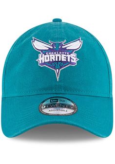 This Charlotte Hornets Teal Adjustable Hat features a front embroidered team logo on a lightly-structured cotton crown, with pre-curved visor and adjustable backstrap. Team logo embroidered on the front, Cloth Strap Closure to dial in the perfect fit, Relaxed, unstructured fit, Pre-curved bill, 100% cotton construction, New Era Flag logo on side, Dad hat, 100% Cotton, Washable, Imported Curved Visor Cotton Hat For Fan Gear, Cotton Curved Visor Hat For Fan Gear, Team-colored Cotton Hat With Embroidered Logo, Team-colored Cotton Hats With Curved Brim, Cotton Hat With Team Logo For Sports Events, Cotton Sports Hat With Team Logo, Curved Bill Cotton Hat For Fan Merchandise, Cotton Curved Bill Hat For Fan Merchandise, Cotton Fan Merchandise Cap