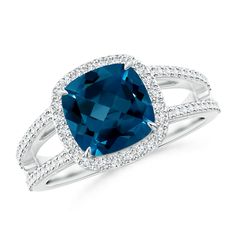 a cushion cut blue topazte and diamond ring