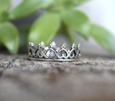 "Sterling Silver Crown ring: - .925 solid sterling silver. - 6mm height, 1.2mm thickness. -US sizes 4-10.5 with half sizes Crown Princess Stacking Set: https://www.etsy.com/listing/172483980/silver-crown-ring-stacking-set-sterling?ref=shop_home_active 💜Check out our new \"Ready to Ship\" section for gifts that ship in 1 business day. https://www.etsy.com/shop/AWildViolet?ref=seller-platform-mcnav§ion_id=23587515 Connect with us on Instagram @a_wild_violet for sales and giveaways! **All items ar Silver Bohemian Promise Jewelry, Bohemian Silver Stackable Rings For Anniversary, Bohemian Sterling Silver Promise Ring, Bohemian Silver Stackable Rings For Wedding, Silver Stackable Midi Rings For Promise, Elegant Sterling Silver Hypoallergenic Toe Rings, Adjustable Dainty Toe Rings In Sterling Silver, Adjustable Dainty Sterling Silver Toe Rings, Elegant Handmade Midi Rings For Promise