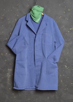 Vintage Workwear Chore Jacket Work Atelier Lab Coat Blue  Looks like size Large  A beautiful, unique piece of vintage workwear shop painter atelier coat with so much character. Great jacket made from durable cotton fabric in classic elongated shape  Concealed button down front fastening Notch lapel collar Two patched hand pockets One chest pocket In lovely vivid faded blue colour Condition - Great vintage condition, slightly brushed and faded, with lovely patina, super comfortable to wear, with normal signs of wear, some spots and with plenty of life left to give! This is the real thing worn by farm workers, shopkeepers, artisans in France who has inspired so many contemporary designers in recent years. This Vintage French work chore coat is made of original strong Sanfor cotton Please kee Retro Pre-washed Cotton Outerwear, Retro Solid Color Outerwear For Work, Fall Pre-washed Outerwear For Work, Pre-washed Fall Outerwear For Work, Vintage Blue Utility Jacket With Pockets, Retro Utility Jacket With Buttons For Work, Retro Utility Jacket For Workwear, Retro Utility Jacket With Pockets For Work, Vintage Utility Jacket With Lapel Collar And Patch Pockets