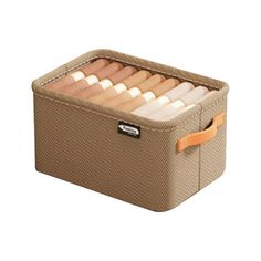 a brown storage box filled with lots of items